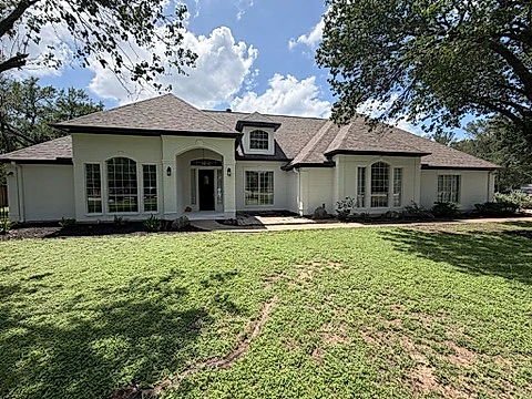 Austin home with brick painted bright white by V&S Painting
