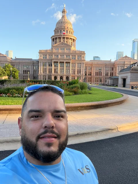 Julio Diaz of V&S Painting in front of the Texas State Capitol in Austin
